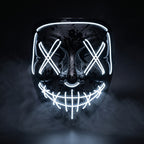 Black splatter shell X-eye LED mask glowing white in smoke