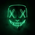 X-eye LED mask glowing emerald green in smoke