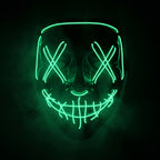 X-eye LED mask glowing emerald green in smoke
