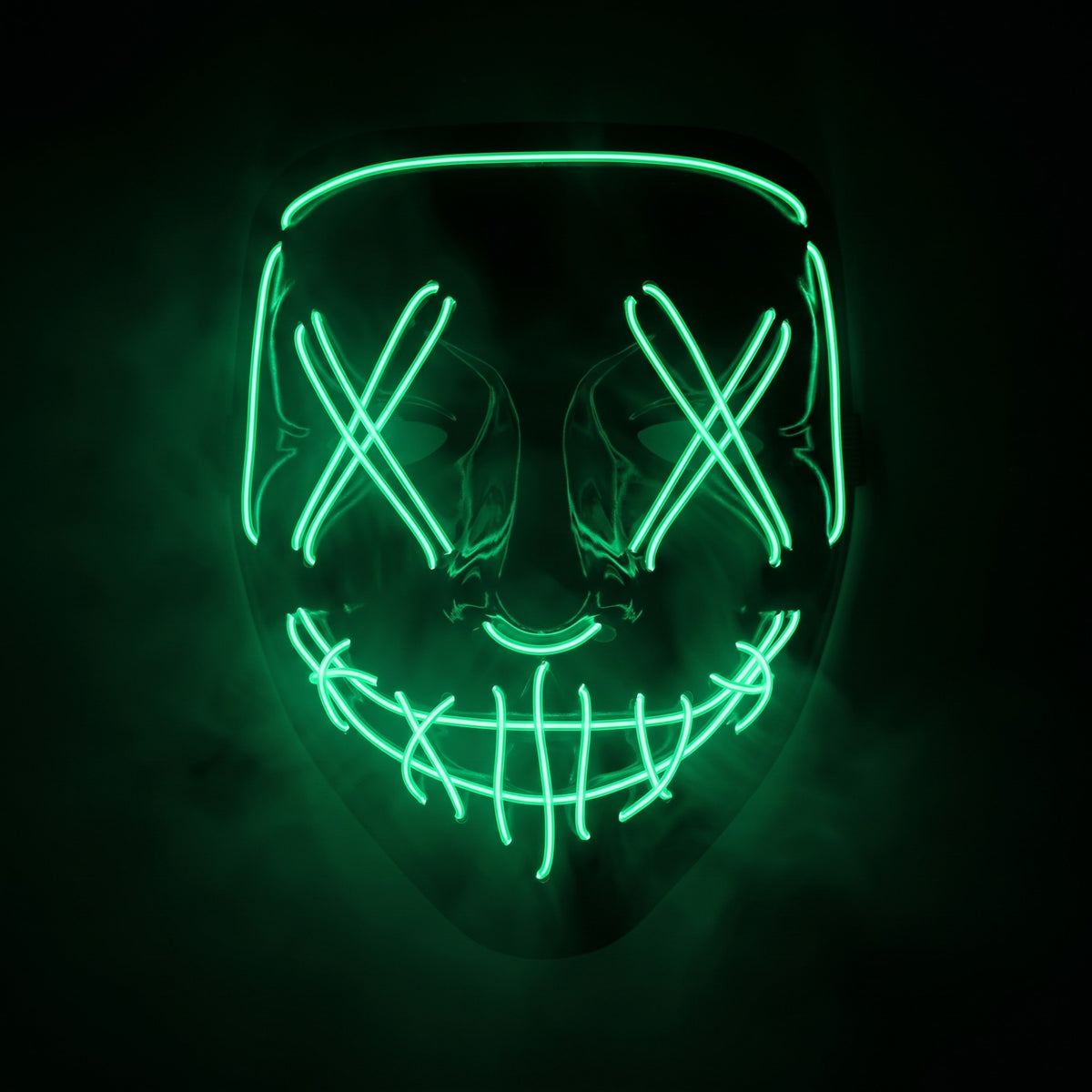X-eye LED mask glowing emerald green in smoke