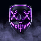 X-eye LED mask glowing purple in smoke