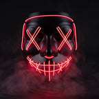 X-eye LED mask glowing red in smoke