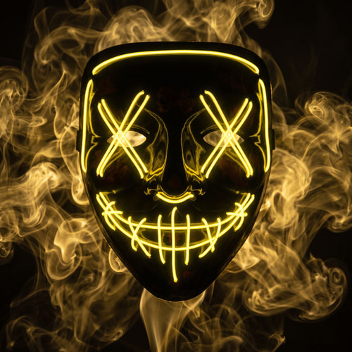 X-eye LED mask glowing yellow in smoke